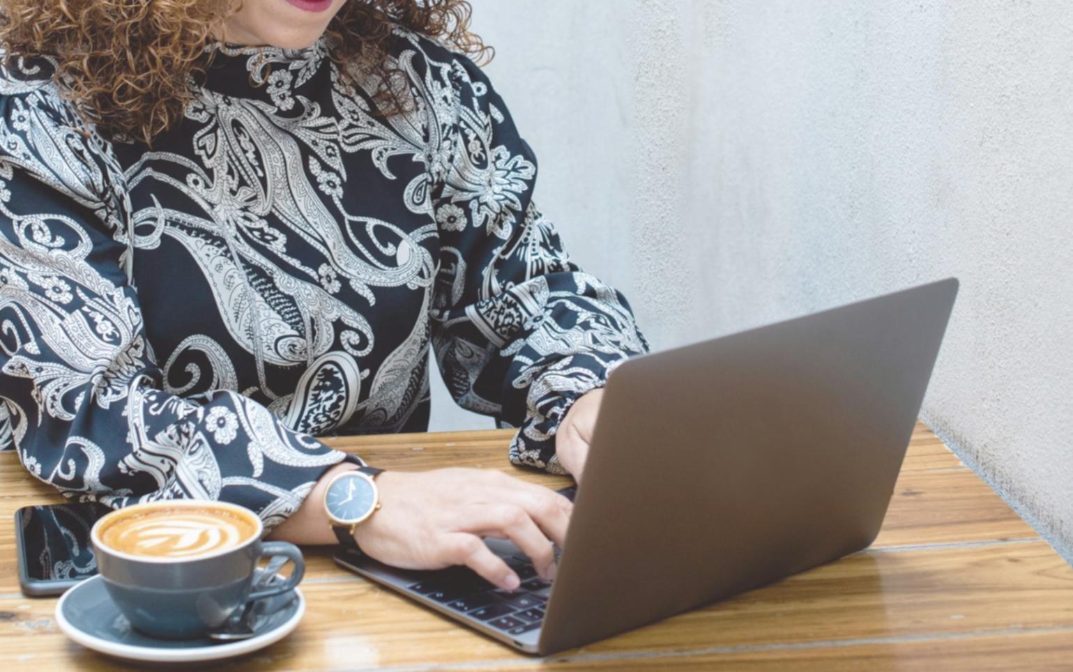 Students working on financial analysis projects during hands-on workshop session